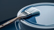 © Busayo - Paintbrush on a blue paint can, bucket of paint and brush, paint can and brush, paint brush and paint can, paint brush and blue paint