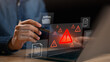 © chaylek - digital warning alert displayed on laptop with document icons, representing system risk, data threat, cyber alerts, file security issues, online protection challenges in modern digital environments.