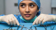 © Helena - Asian woman in surgical scrubs, focused on arranging medical instruments on a blue table, showcasing precision and professionalism in a clinical environment