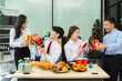 © NINENII - Asian people, celebrating together and gift exchange at Merry Christmas & Happy New Year. excited businessman feel happy work complete and celebration successful deal.