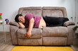 © Gatot - Relaxed Man Peacefully Napping on Comfortable Couch at Home