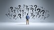 © Lady O - A man is standing with his back to the camera, surrounded by question marks.