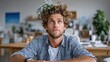 © Pinklife - A man in casual attire gazes upward while adorned with flowers in his hair, portraying a deep introspection and connection to nature in a vibrant indoor space.