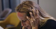 © Marco - Frustrated businesswoman grabs hair with both hands and head down, dealing with intense workplace burnout and emotional collapse inside empty meeting room