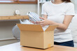 © Pormezz - person unboxing package shopping online via internet at home
