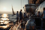 Trophy displayed on a yacht during sunset sailing event with crew members enjoying the scenic views and calm waters around them