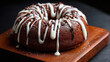 © Екатерина Чумаченко - Indulge in the charm of this chocolate bundt cake, adorned with white icing and chocolate sprinkles, presented on a rustic wooden board.