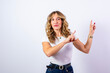 © pacoocimage - Woman pointing fingers indicating direction copy space