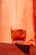 © ADDICTIVE STOCK - Negroni cocktail on rustic orange background