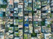 © AmazingAerialAgency - Aerial view of the crowded rooftops, a mosaic of textures and colors, where urban life thrives amidst the dense building blocks, Dhaka, Dhaka Division, Bangladesh.