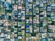 © AmazingAerialAgency - Aerial view of dense urban dwellings, where rooftops sprout verdant life amidst the concrete jungle, creating a textured mosaic of nature and architecture, Dhaka, Dhaka Division, Bangladesh.