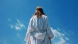 © Oleh - Jesus christ, wearing a white robe, is seen from behind, looking up towards a bright blue sky with wisps of white clouds, symbolizing spirituality and faith