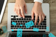 © New Africa - Woman sending or receiving email on laptop at table, top view. Letters flying out of screen