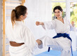 © JackF - Karate practitioners showcase their techniques in dynamic sparring session, focusing on speed and accuracy.