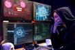 © DC Studio - Hooded hacker in disbelief after seeing critical error message on PC when trying to steal data. Rogue software developer perplexed after failing to exploit system flaws using artificial intelligence
