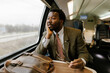 © Mihajlo Ckovric/Stocksy - Tired Businessman Traveling by Train Sitting With a Briefcase