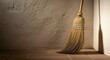 © antuanetto - Old straw broom standing in a rustic kitchen corner against a textured wall for domestic cleaning concept and simple household chores