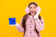 © Olena - happy new year. merry christmas. amazed smiling kid in winter earmuffs with box.