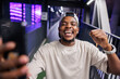 © Jovo Jovanovic/Stocksy - Joyful man celebrates with fist pump in urban setting.