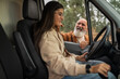 © Lupe Rodriguez/Stocksy - Father giving driving instructions to young woman in campervan