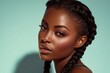 © Surachetsh - A confident young black woman poses under soft studio lights that highlight her flawless skin and expressive eyes, a modern sense of beauty with calm, elegant charm.