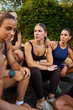 © Javier Díez/Stocksy - Group of women discussing fitness strategies outdoors