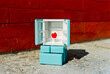 © Juan Moyano/Stocksy - toy fridge with one apple, 35mm film