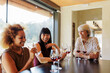© BONNINSTUDIO/Stocksy - Female friends enjoying wine tasting experience