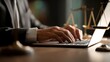 © HPMP Studio - Lawyer working on laptop, legal professional typing documents in office.