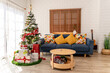 © Kawee - Cozy living room decorated for Christmas with a beautifully adorned tree