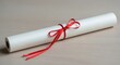 © Imam - Rolled Diploma with Red Ribbon on Neutral Background.