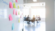 © AucArtStudio - Marketing plan brainstorming sticky strategy business idea creativity note planning teamwork meeting room with colorful notes board and team