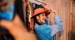 © Big Shot Theory - A Joyful and Vibrant Moment Captured in a Vintage Clothing Store Featuring a Colorful Hat