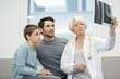 © auremar - female doctor pediatrist and boy looking at xray