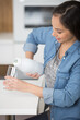 © auremar - woman pours milk into a glass