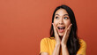 © sangidatul - Surprised Woman With Hands On Cheeks Looking Up in Amazement