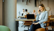 © BGStock72 - Business woman talking on phone in modern office setting during daytime