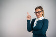 © Nenad - Portrait of smiling business woman pointing finger
