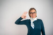 © Nenad - Smiling business woman showing OK hand gesture on isolated background