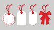 © zihad - Four blank tags with red ribbons displayed on a gray background, ready for labeling or decoration..eps