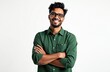 © miss irine - Young latin man wearing glasses and green shirt smiles confidently. He has arms crossed against plain gray backdrop, looking directly forward with friendly expression. Professional studio portrait.