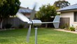 © DigitalSpace - Medium shot capturing the sleek blades of a horizontal axis wind turbine in a backyard highlighting efficient harnessing of wind for home energy needs.