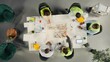 © DC Studio - Top down view of diverse colleagues consulting on a master plan for urban development. Property developers review architectural software and designs to achieve real estate growth.