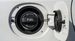 © donnydarumi - Close-up view of a cars fuel tank cap, indicating the fuel input for the vehicle.