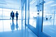 © chenyi - modern office interior with close-up of glass door and window in blue tone background featuring blurry business people walking in wide-angle composition for corporate and architectural use
