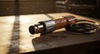 © ajib ajib - Macro composition of a retro soldering gun on a brown wooden table under morning light