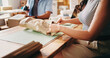 © OnPoint/peopleimages.com - Paper, packaging and hands of woman in office with distribution for delivery, shipping or courier. Ecommerce, package and small business owner with preparation on parcel for cargo, order or process