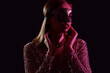© Pixel-Shot - Beautiful young woman wearing carnival mask on dark background