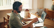 © peopleimages.com - Headphones, laptop screen or man with graphs in home for data analysis, stocks news or music playlist. Freelancer, trader and crypto dashboard for monitoring stats, market research or trading podcast