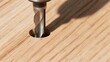 © cloe - Close-up of a drill bit creating a hole in a wooden surface.